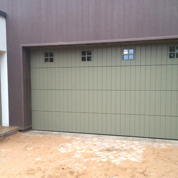 Okoume clad garage door & front door with same design windows