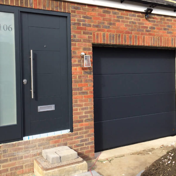 Front door with letter plate and house number on sidelight