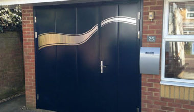 Side hinged door with custom stainless steel applique