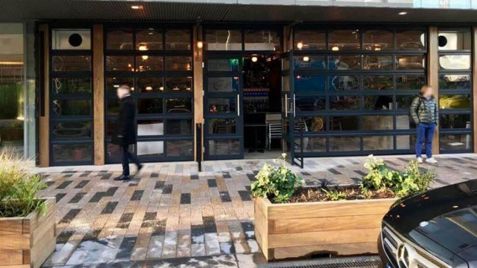 Vagabond (1) Façade formed out of of glazed sectional doors