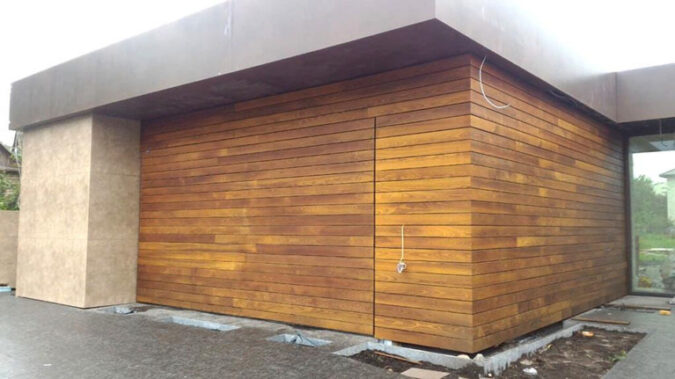 Garage door clad with oak planks