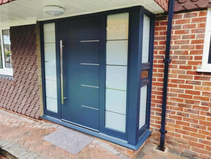 Aluminium door with corner sodelights