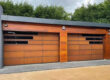 Twin garage doors clad with weathered corten