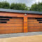 Twin garage doors clad with weathered corten