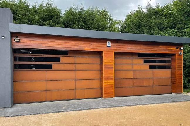 Twin garage doors clad with weathered corten