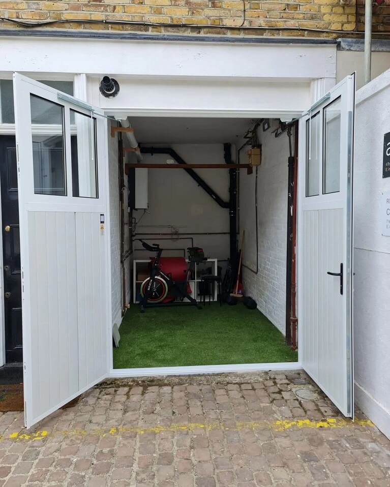 Garage conversion into workshop with customised Traditional design garage door
