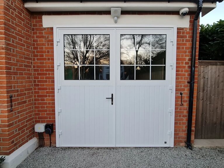 Garage conversion into dressing room with customised Traditional design garage door